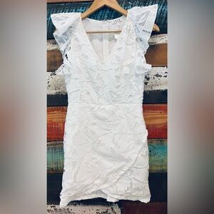 Lacy overlay TCEC brand white ruffle sleeve dress